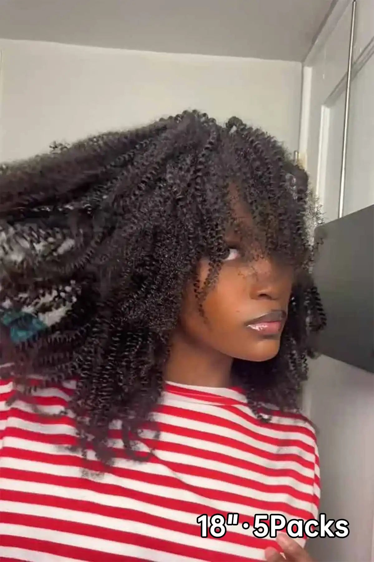 Tiktok influencer pureroyaltie shows the braiding process of afro kinky curly feather crochet hair extension