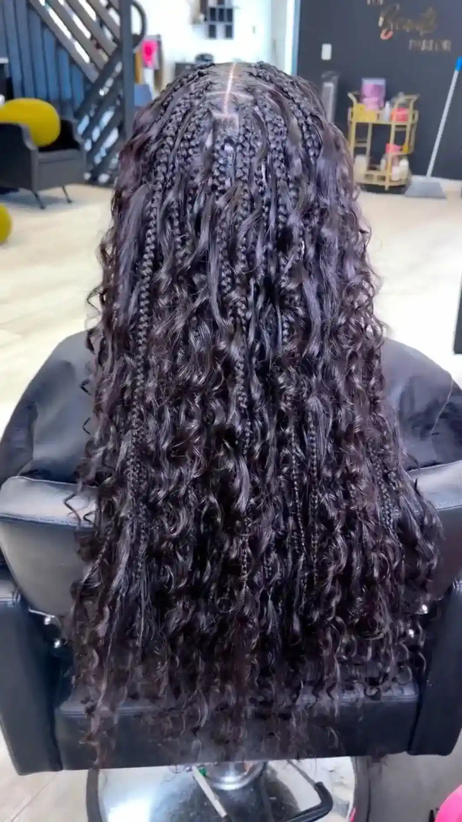 Person with styled hair in a salon chair