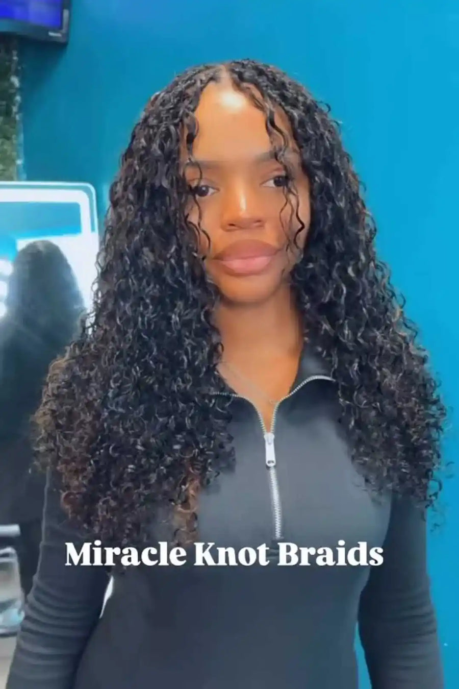 Person with long, curly hair styled in 'Miracle Knot Braids' against a blue background