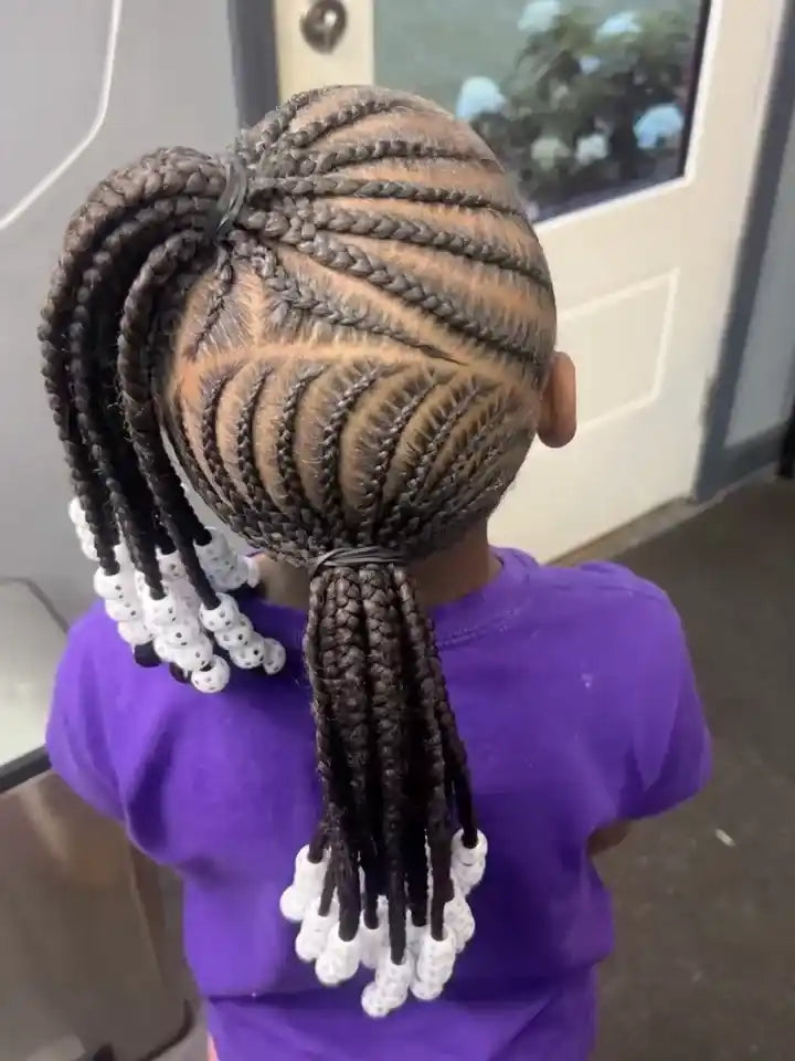 Kids double braided ponytails with curved cornrow patterns and white beaded ends, hairstylist located in Atmore, AL