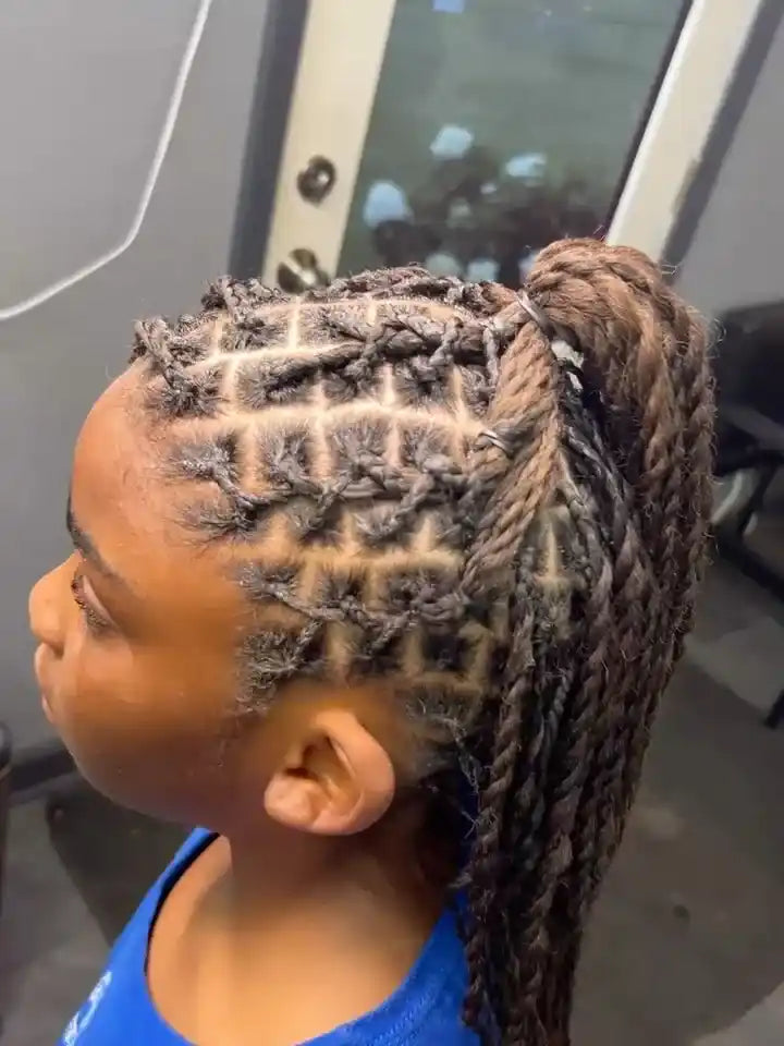 High braided ponytail with geometric crisscross sections and feed-in braid detailing, hairstylist located in Atmore, AL