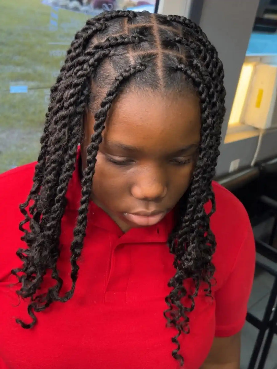 Shoulder-length black rope twists with clean square parts and soft curled ends, hairstylist located in Atmore, AL
