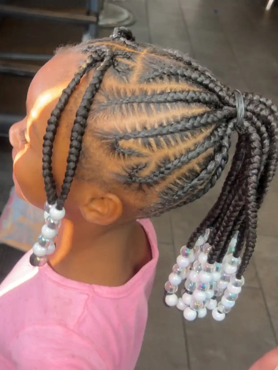Kids high braided ponytail with detailed curved cornrows and white translucent beads, hairstylist located in Atmore, AL