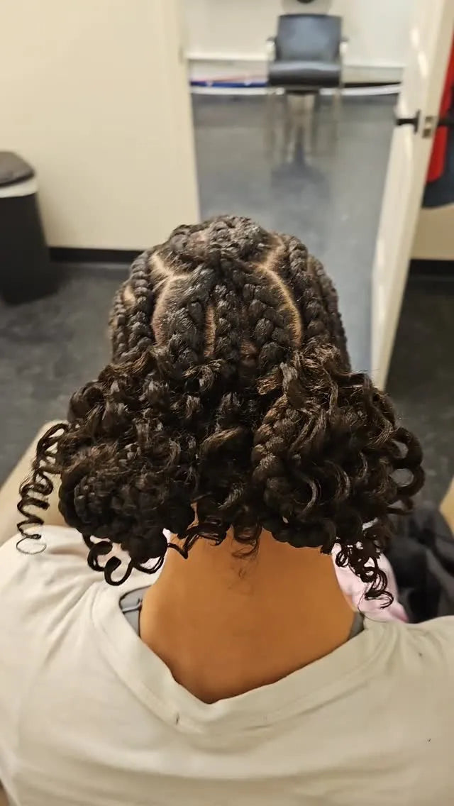Short chunky box braids with defined spiral curls at the ends and clean scalp parting, Stylist located in Greensboro, NC