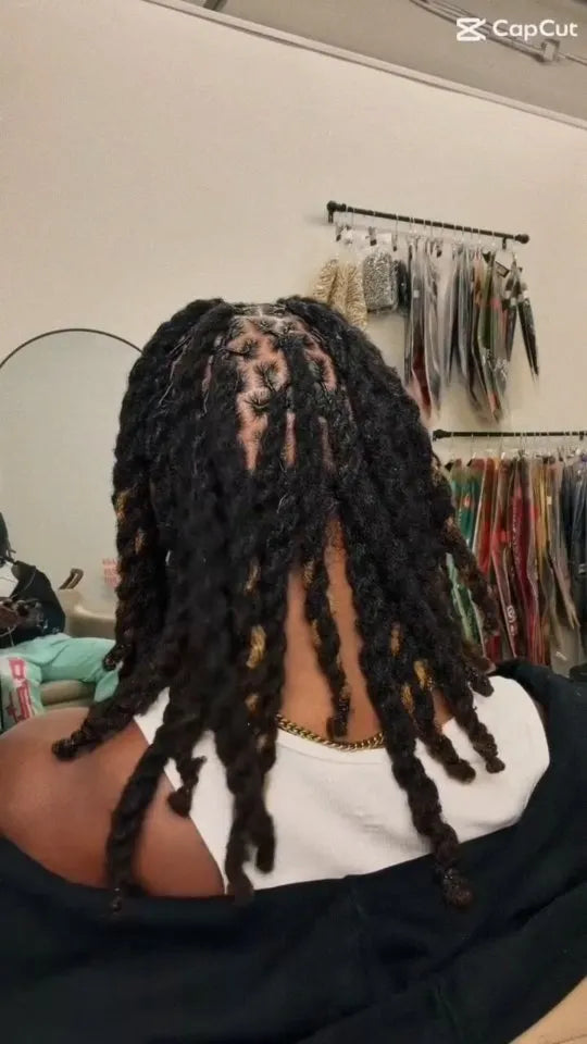 Short black chunky locs with defined square parting and a textured shoulder-length style, Stylist located in Greensboro, NC