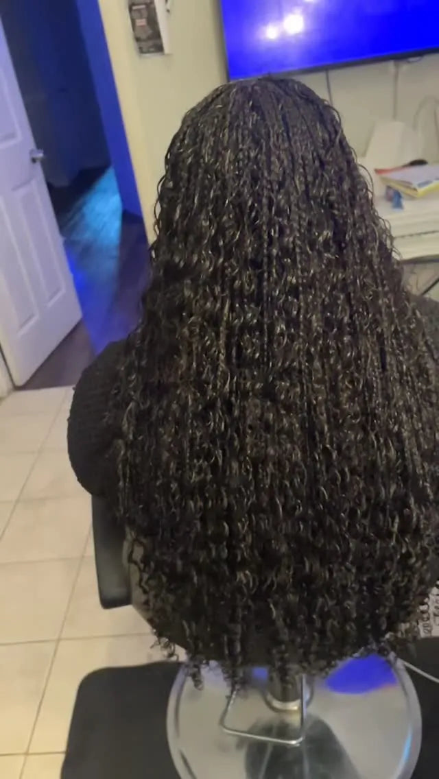 Long black curly crochet braids with soft spiral texture and layered length, hairstylist located in Hueytown, AL
