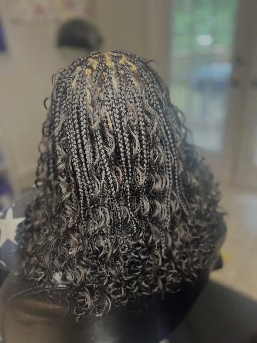Shoulder-length black boho knotless braids with loose curls and defined curly ends, hairstylist located in Hueytown, AL