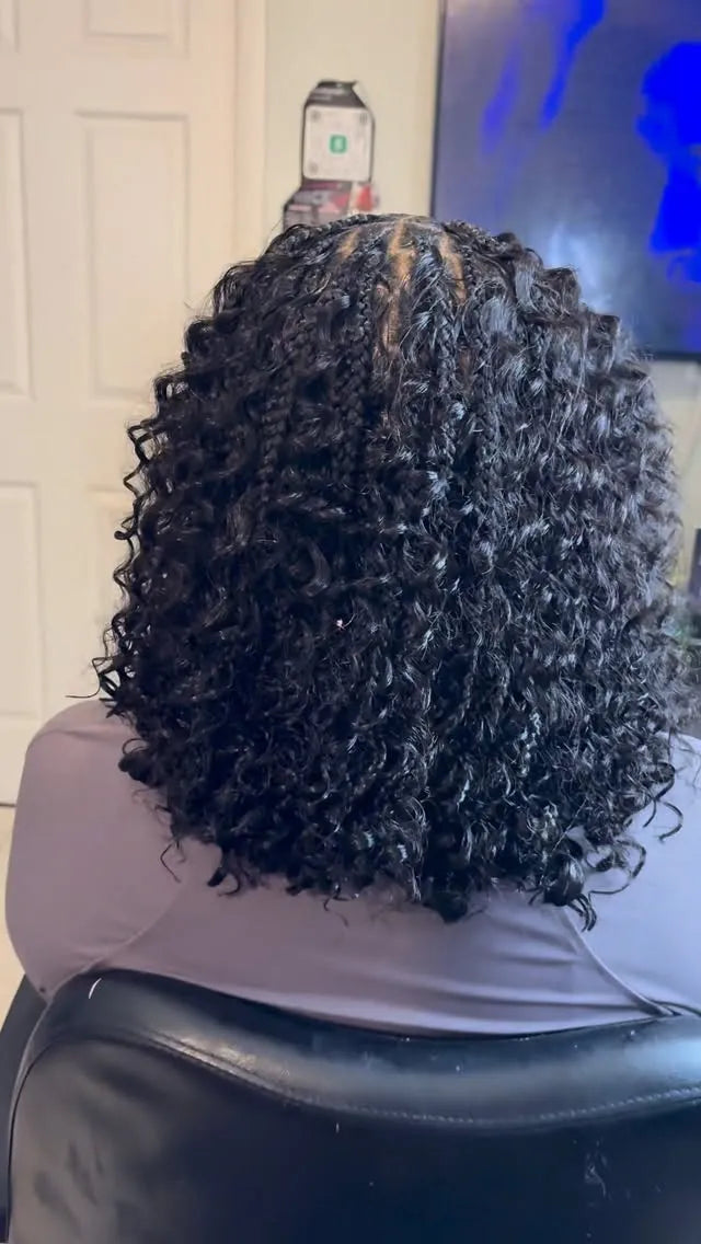 Shoulder-length black boho twists with full defined curls and braided accents, hairstylist located in Hueytown, AL