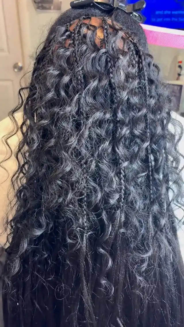 Long black crochet curls with small braided accents and a natural layered finish, hairstylist located in Hueytown, AL