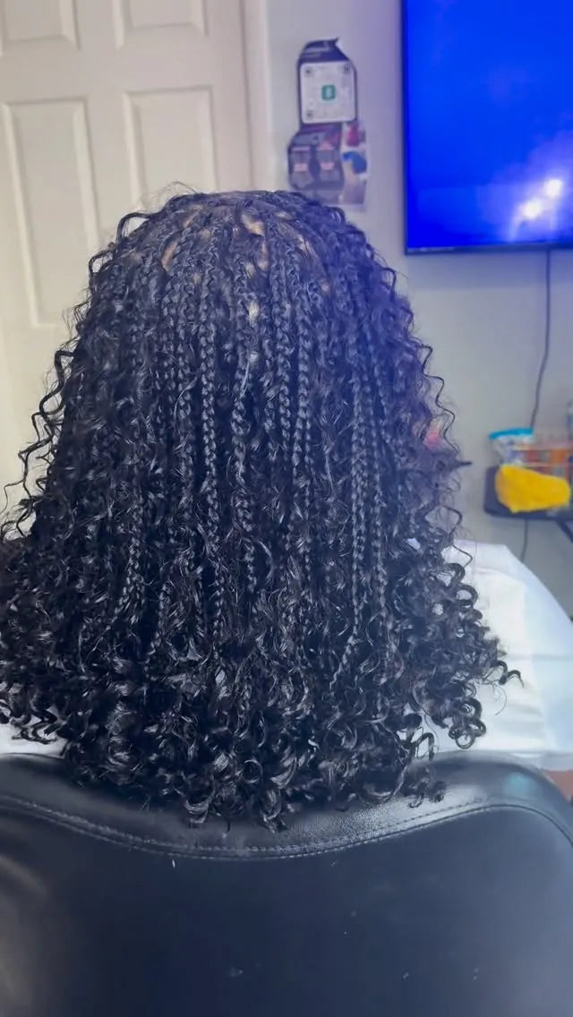 Shoulder-length black boho braids with loose spiral curls and a rounded bob shape, hairstylist located in Hueytown, AL