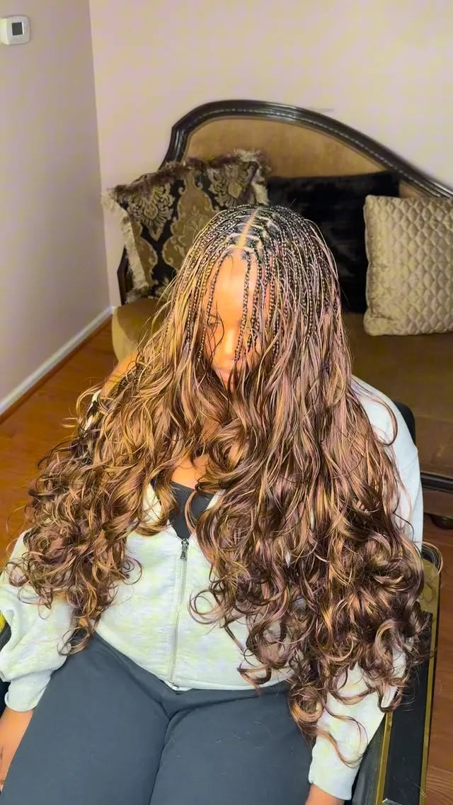 Long mixed brown boho braids with loose curls and center part, hairstylist in Sicklerville, NJ