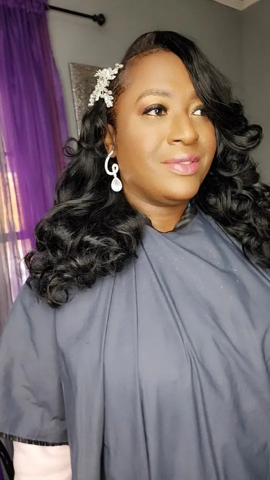 Side-part black Hollywood wave hairstyle with soft voluminous curls and jeweled hair accessory, hairstylist located in Morrisville, North Carolina