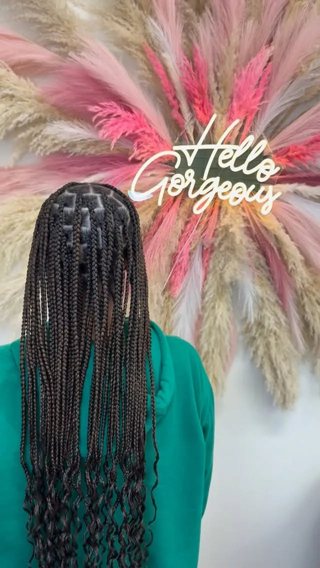 Long small box braids with curly ends and neat square parting, hairstylist located in Morrisville, North Carolina