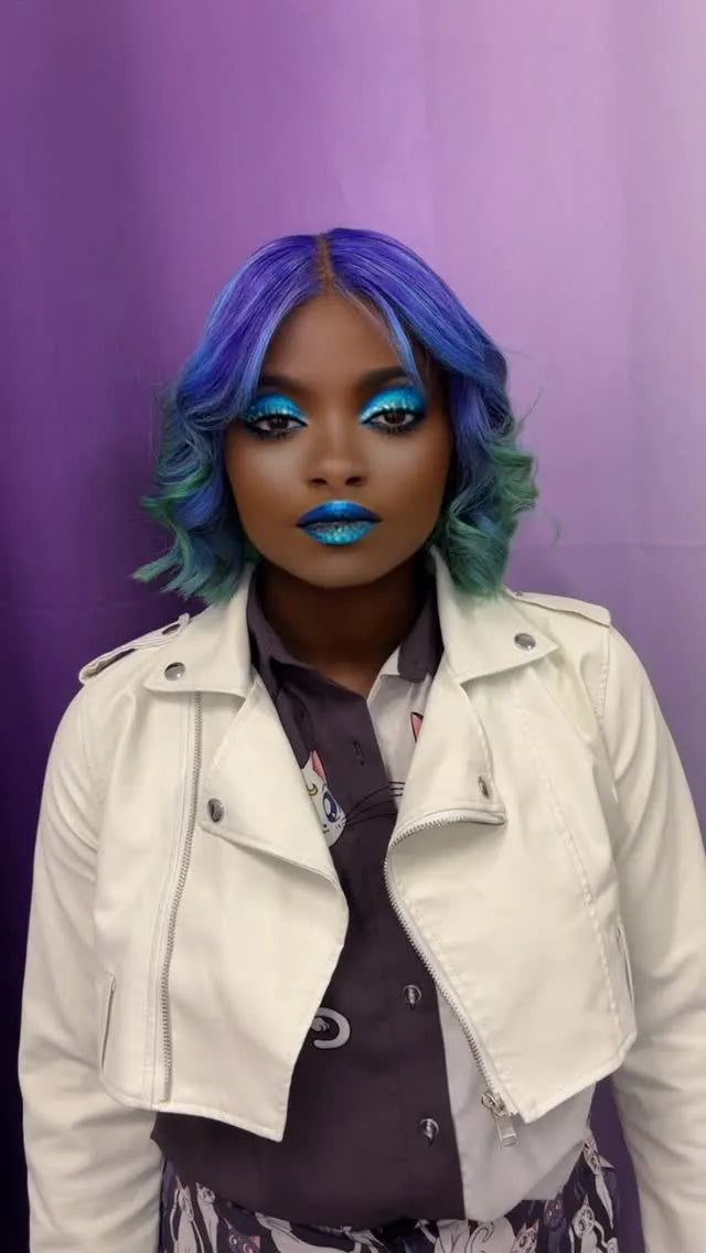 Purple and teal wavy bob hairstyle with soft face-framing curls, hairstylist located in Morrisville, North Carolina