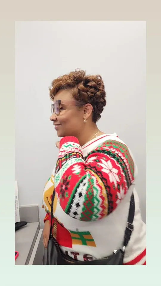 Short copper pixie cut with soft curls and tapered sides, hairstylist located in Morrisville, North Carolina