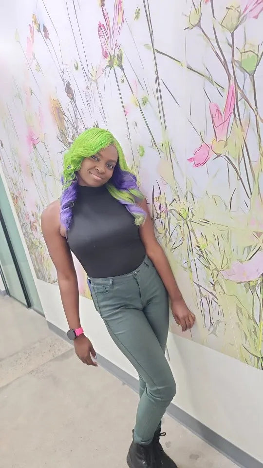 Neon green and purple curled hairstyle with side part and bold color blend, hairstylist located in Morrisville, North Carolina