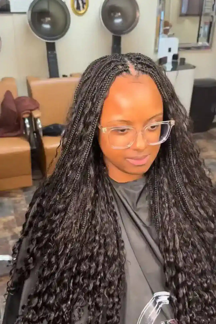 Woman with braided hair in a salon setting