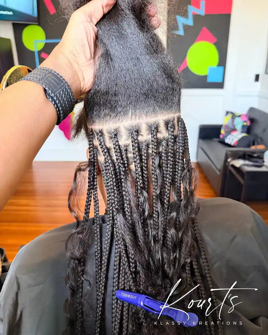 Boho knotless braids installation with clean parts, hairstylist in Thomasville, GA