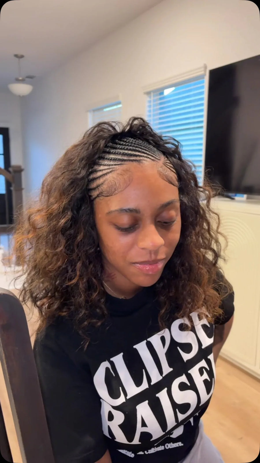 Half cornrow half curly hairstyle with loose brown curls, hairstylist in Houston, TX