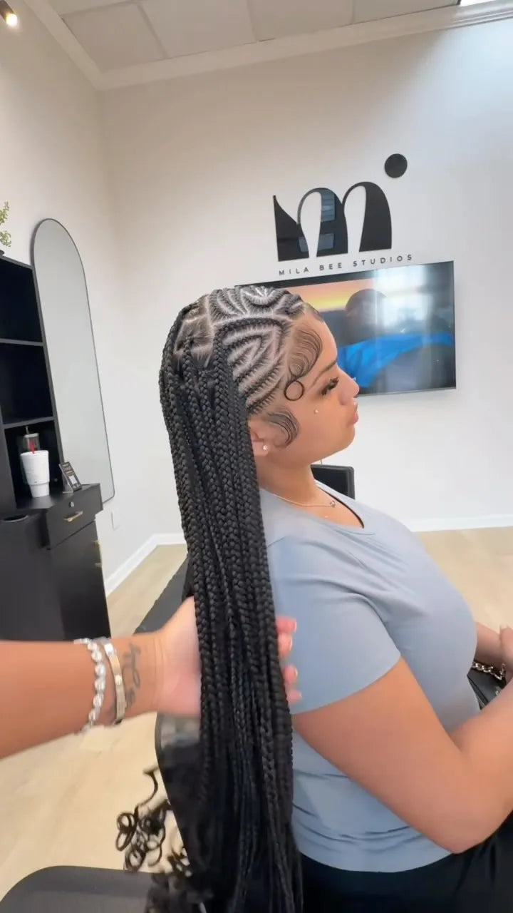 Long stitch braids with creative side design and sleek edges, hairstylist in Houston, TX