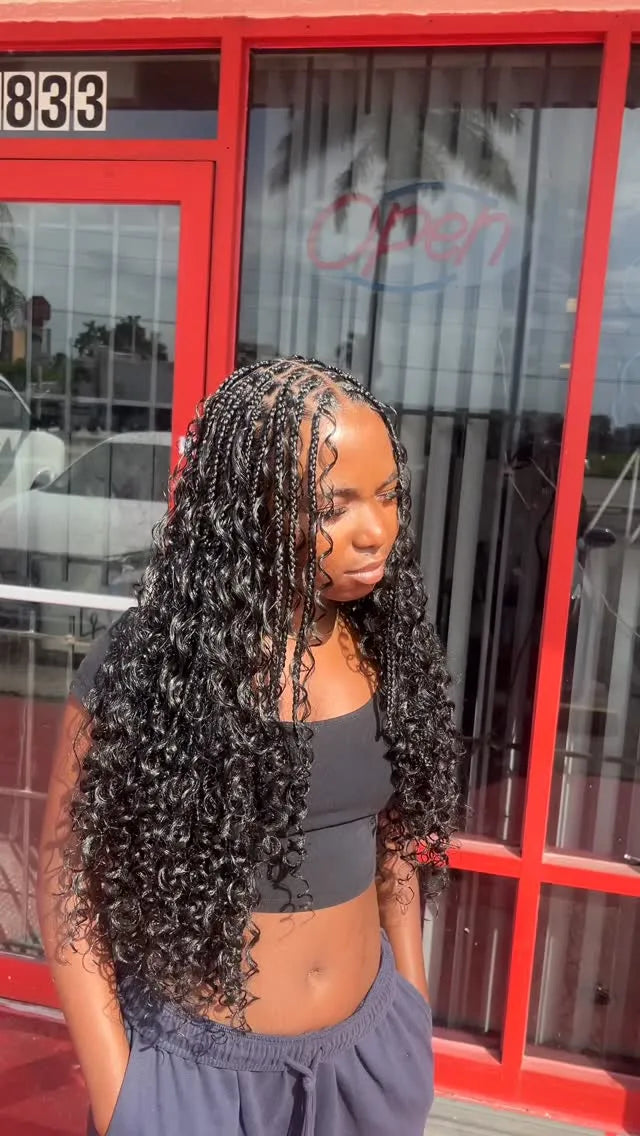 Long boho knotless braids with loose curly human hair ends, Stylist located in Homestead, FL