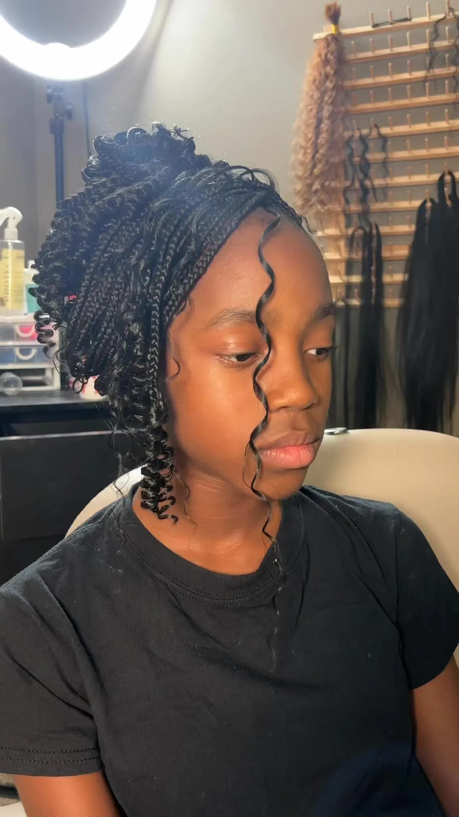 Kids boho knotless braids updo with loose face curl, Stylist located in Smyrna, GA