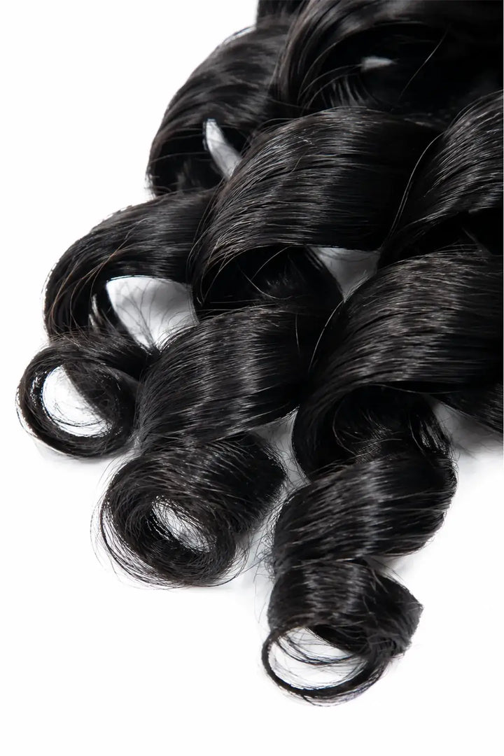 Detail of double drawn feather crochet hair extension french curl human hair