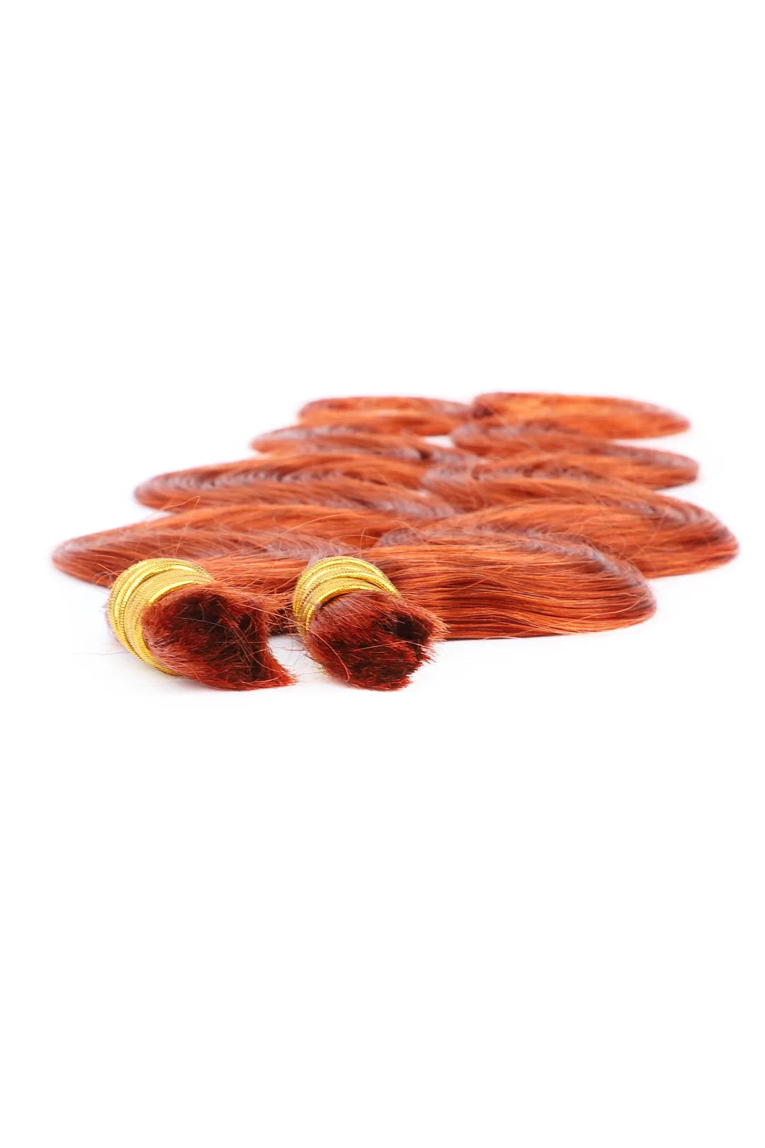 Detail of the ends of 350  ginger body wave bulk human hair for braiding bu24