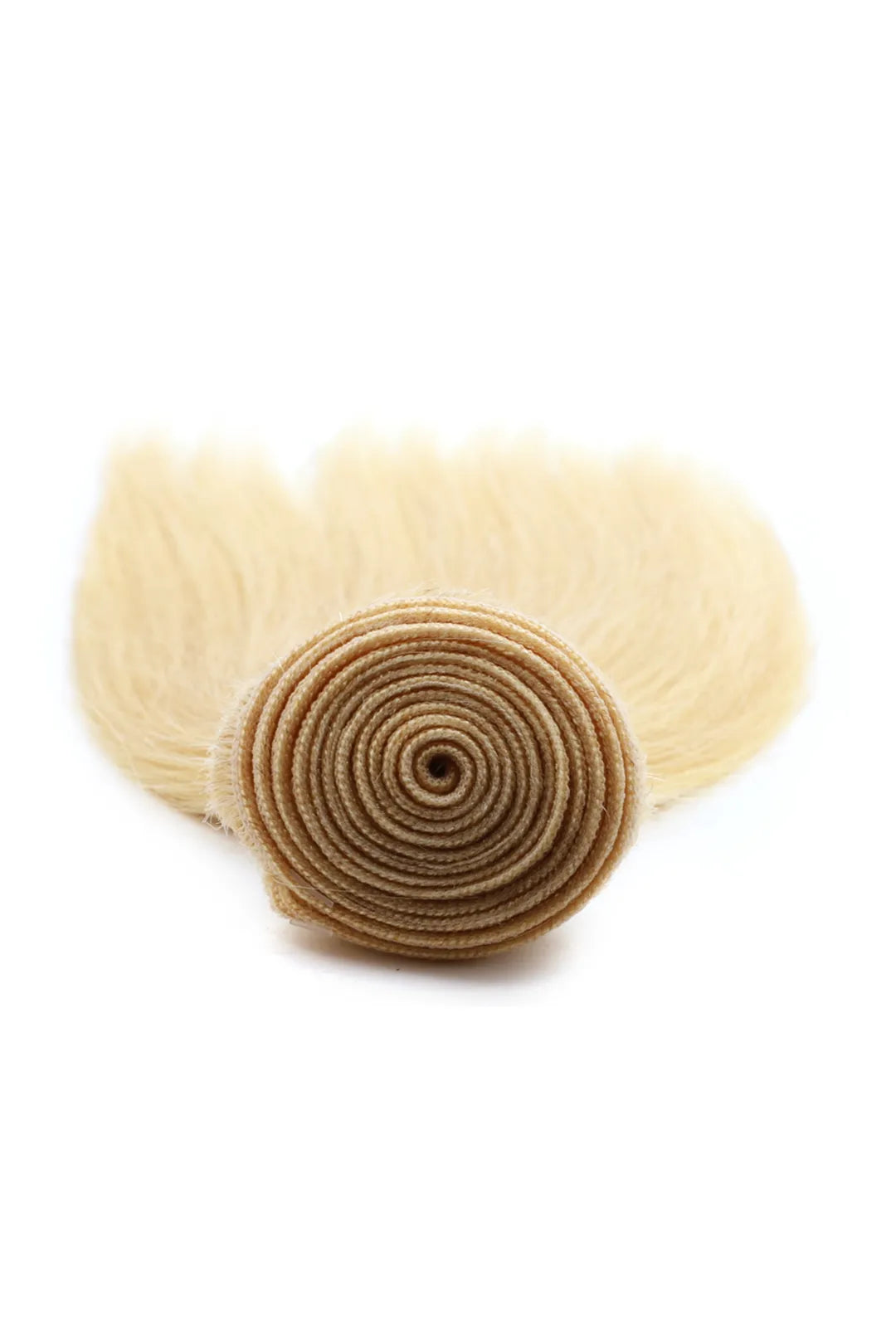 Detail of the ends of 613 blonde bundles double weft sew in extensions straight virgin hair