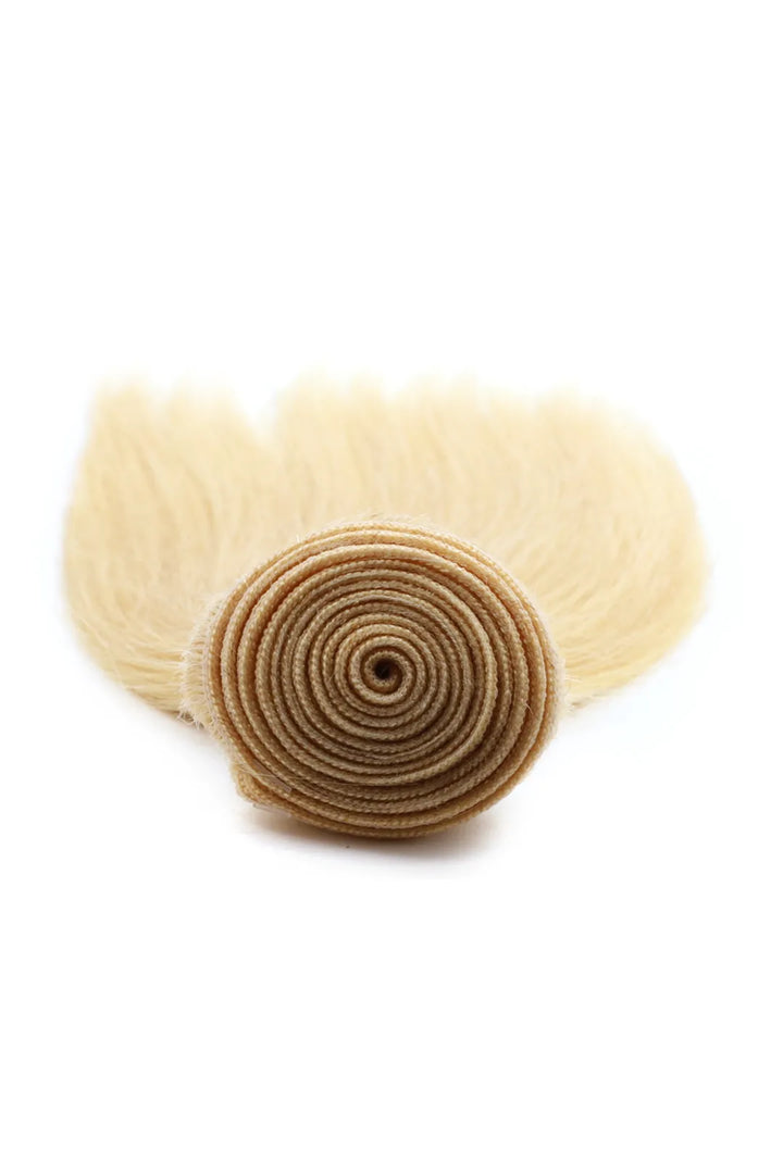 Detail of the ends of 613 blonde bundles double weft sew in extensions straight virgin hair