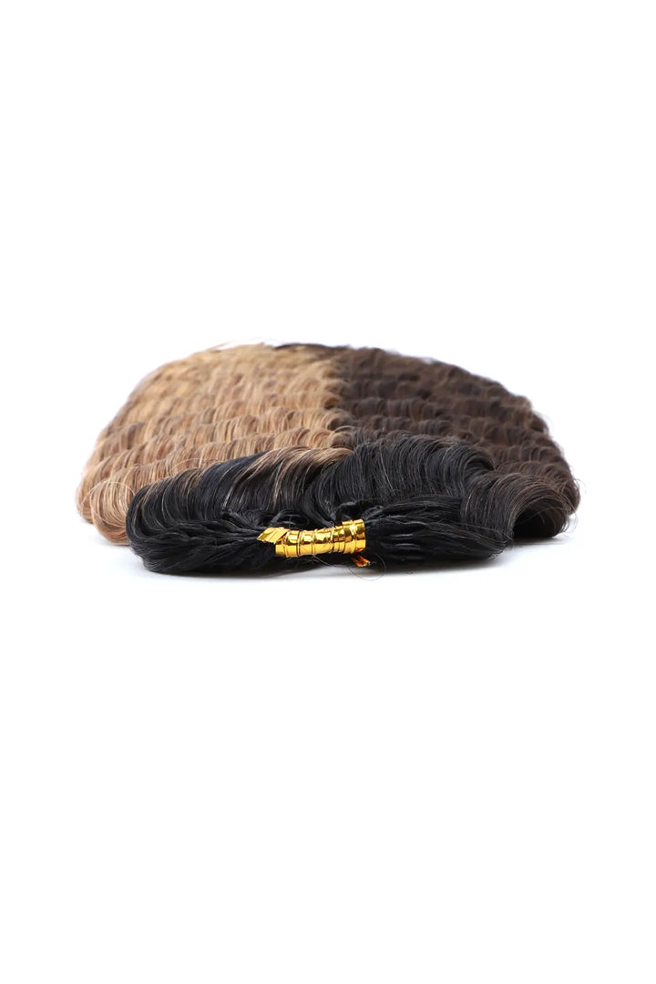 Detail of the ends of T natural black root piano color #4/#27 deep wave feather crochet human hair