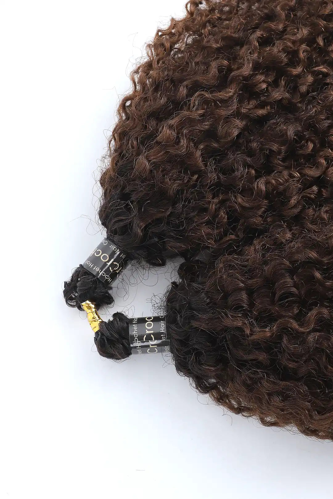 Detail of the ends of #T1B/4 Ombre color tight curly feather crochet human hair