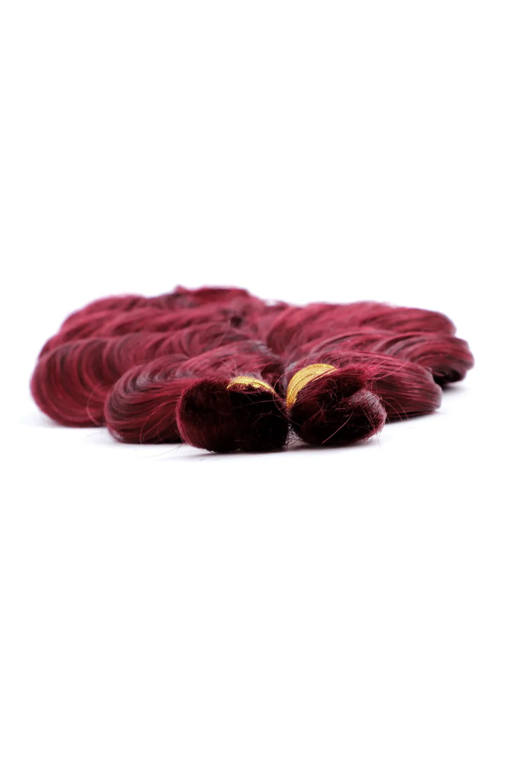 Detail of the ends of burgundy 99j loose wave bulk human hair for braiding