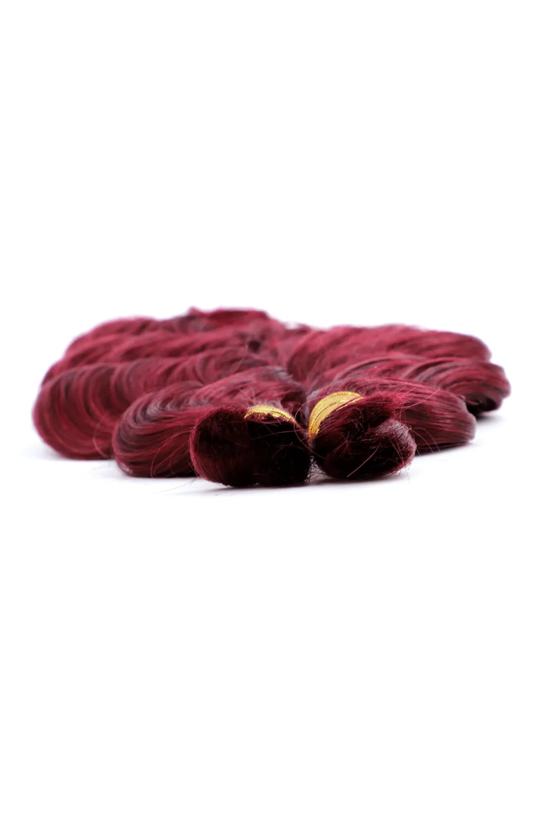 Detail of the ends of burgundy 99j loose wave bulk human hair for braiding