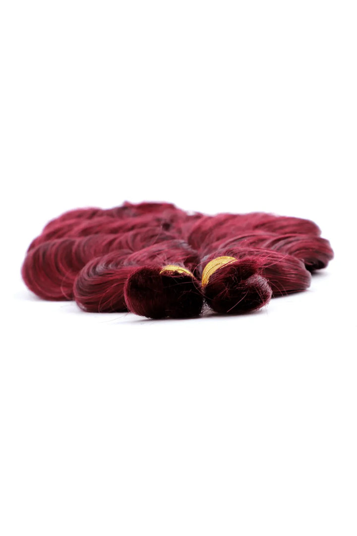Detail of the ends of burgundy 99j loose wave bulk human hair for braiding