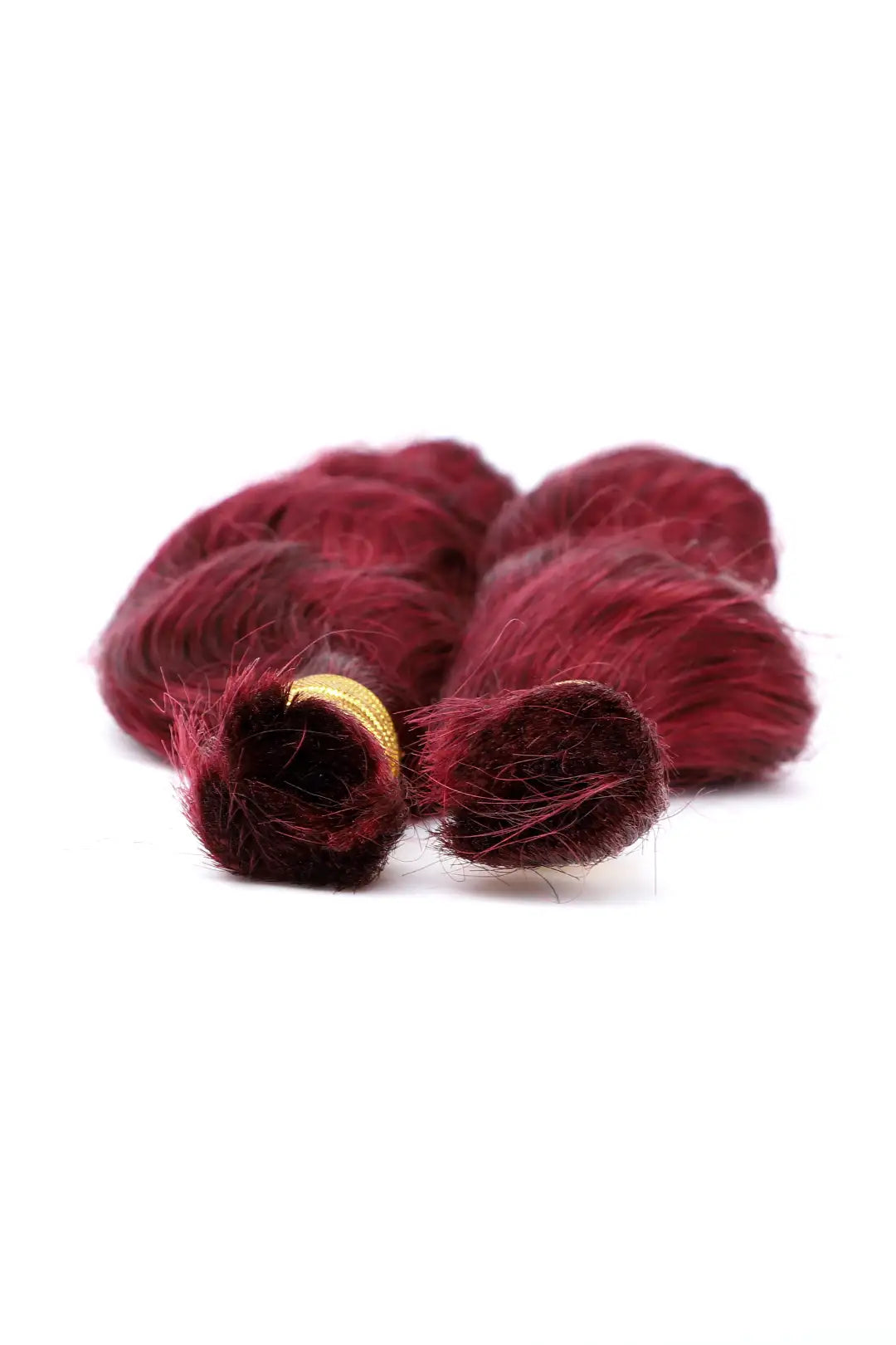 Detail of the ends of burgundy 99j loose wave bulk human hair for braiding
