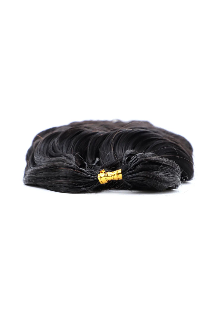 Detail of the ends of feather crochet hair extension loose wave human hair