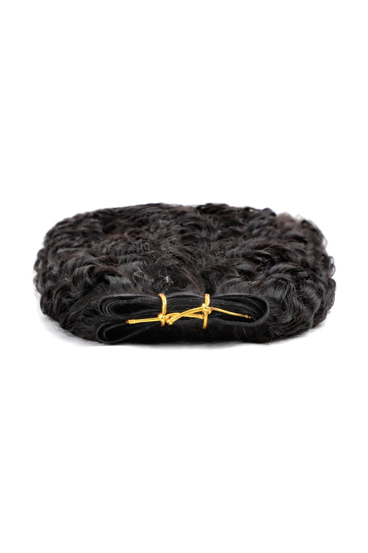 Detail of the ends of genius weft hair extensions water wave black virgin hair