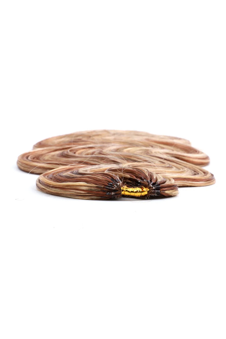 Detail of the ends of highlight blend #27/30/613 body wave feather crochet human hair