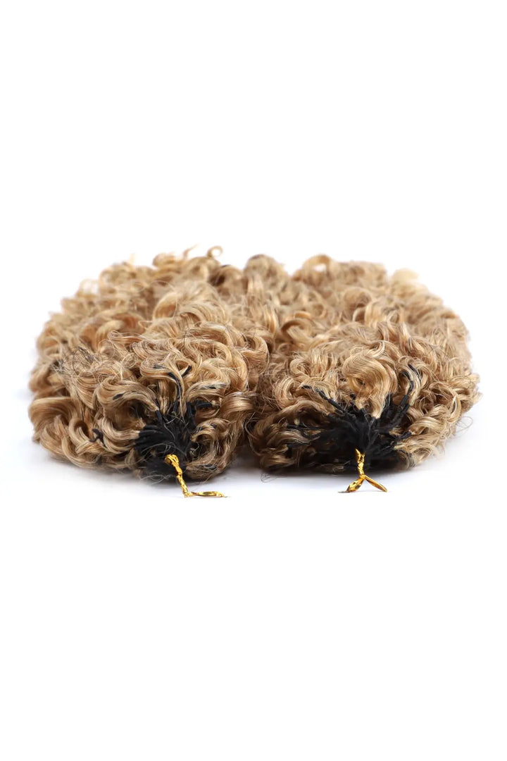 Detail of the ends of honey blonde #27 water deep wave feather crochet miracle knots hair
