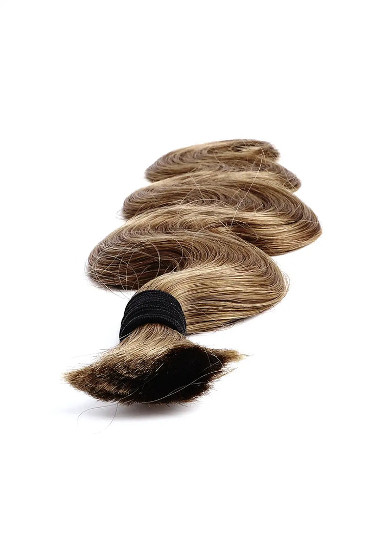 Detail of the ends of light blonde body wave bulk human hair