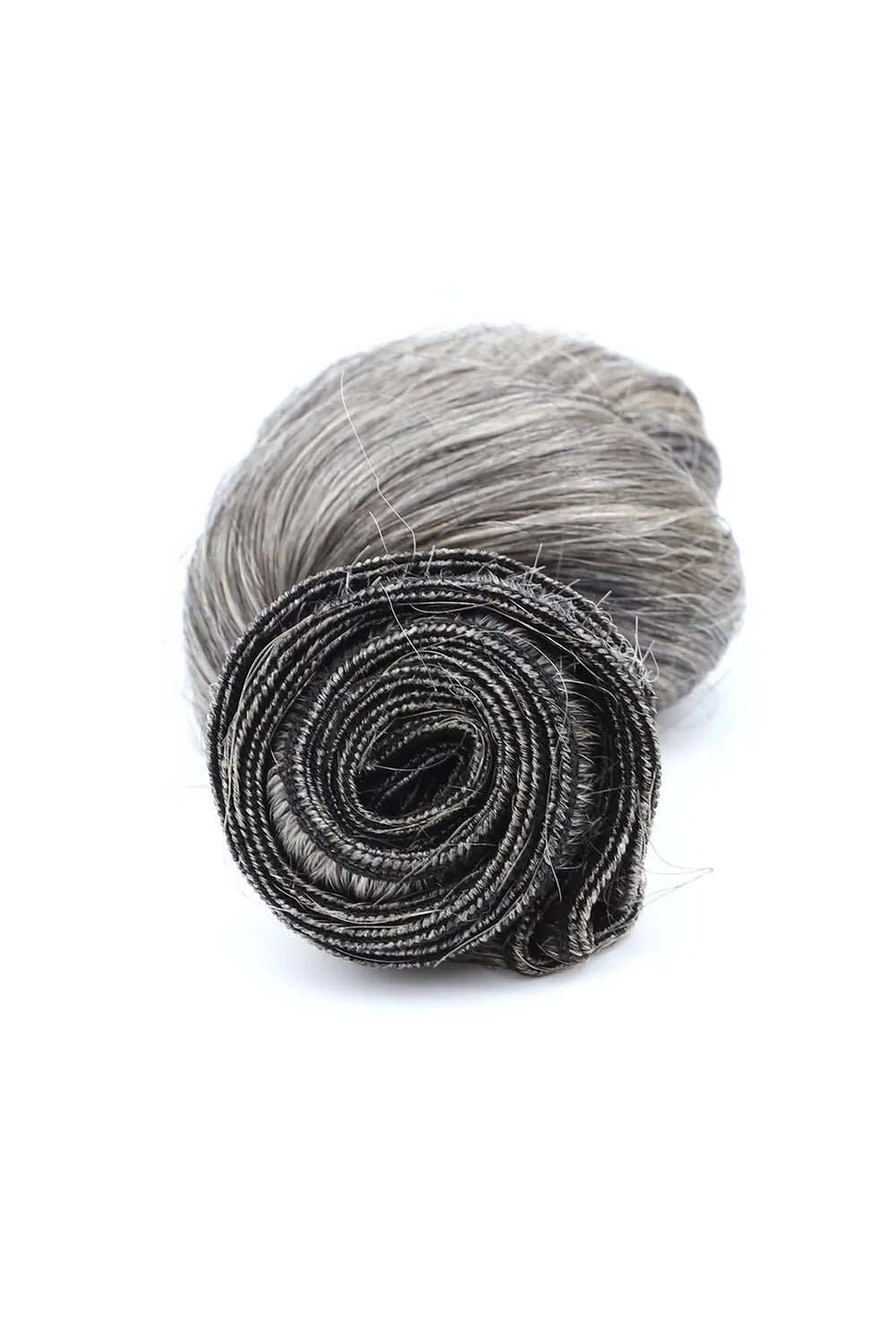Detail of the ends of salt and pepper sew in extensions loose wave virgin hair 70 gray
