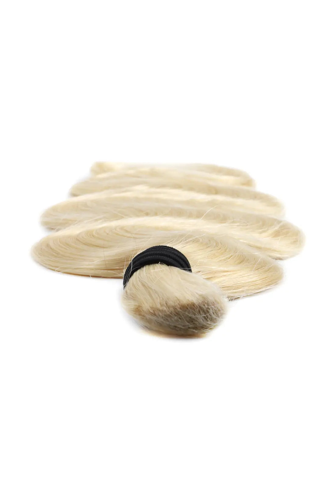 Detail of the ends of single drawn 613 blonde body wave bulk human hair for braiding
