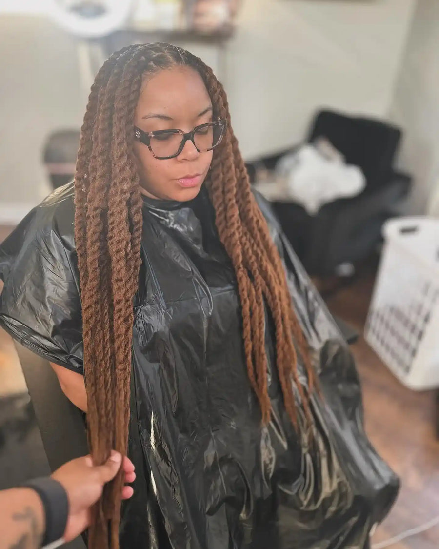 Extra-long brown jumbo rope twists with a neat center part, hairstylist located in Fairview Heights, IL