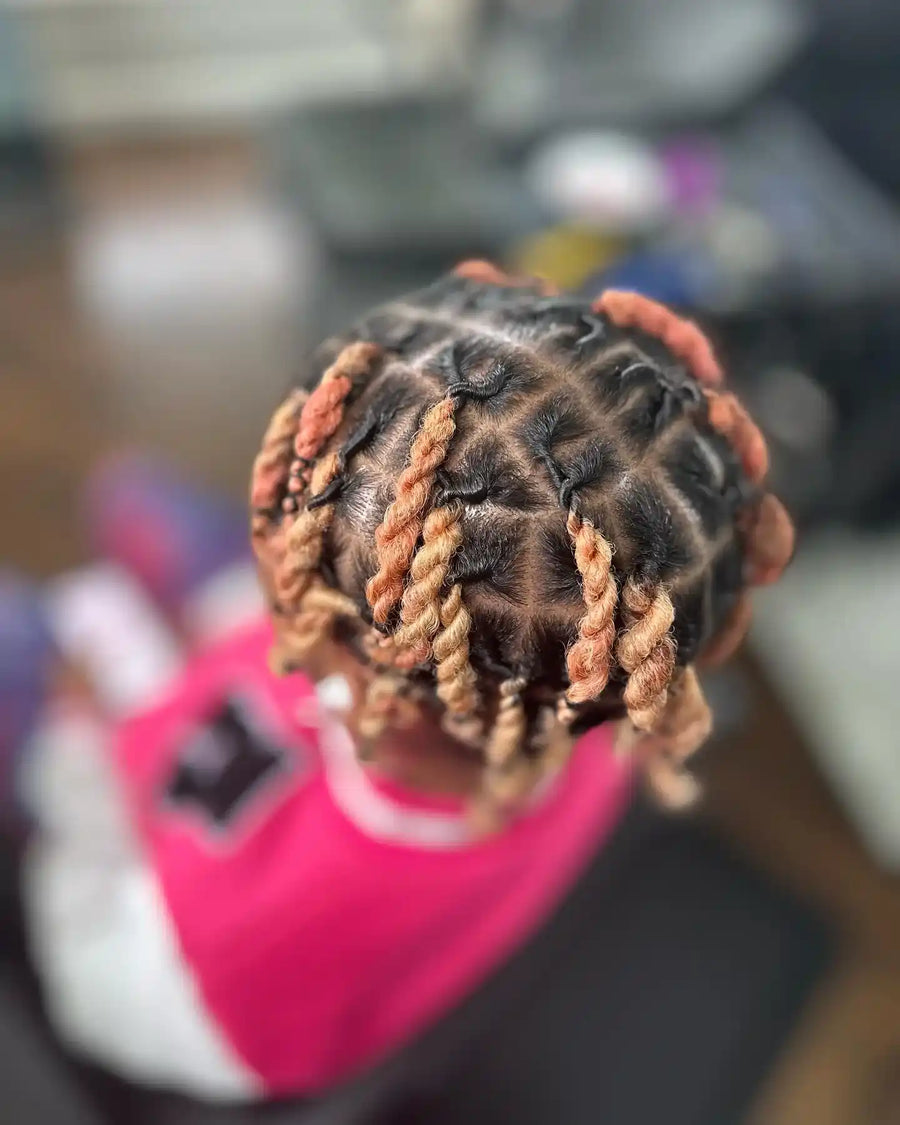 Kids’ short copper two-strand twists with clean square parting, hairstylist located in Fairview Heights, IL