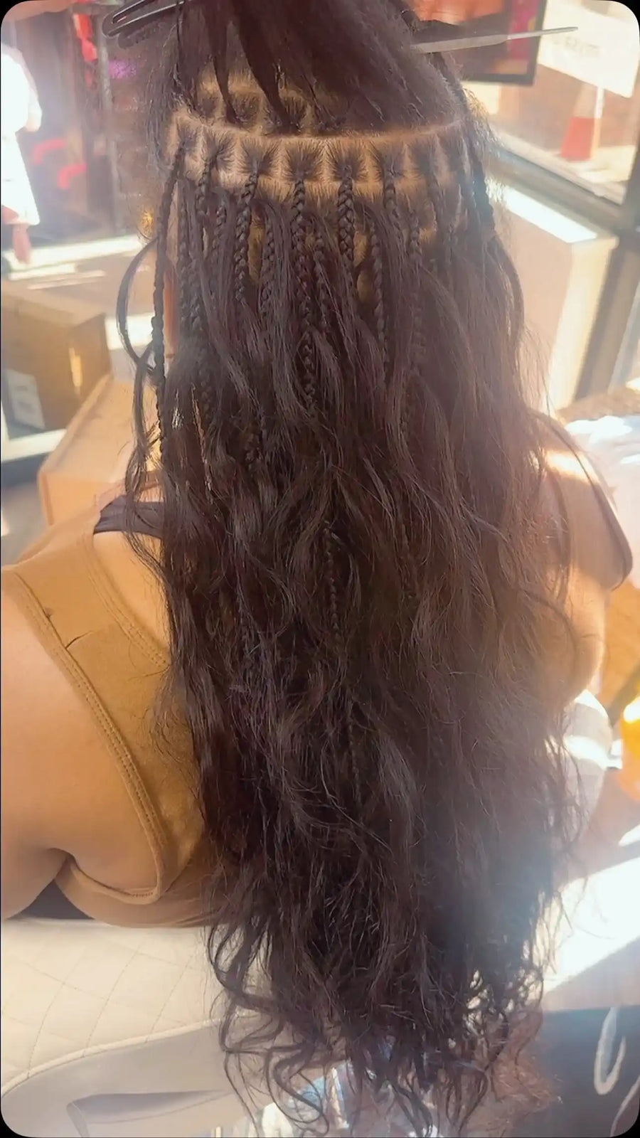Long boho braids with small braided roots and loose natural black wavy hair extensions, Stylist located in Bartlett, TN