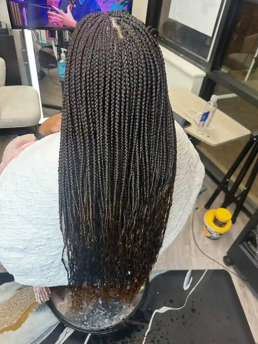 Long small black box braids with neat scalp parting and softly curled ends, Stylist located in Bartlett, TN