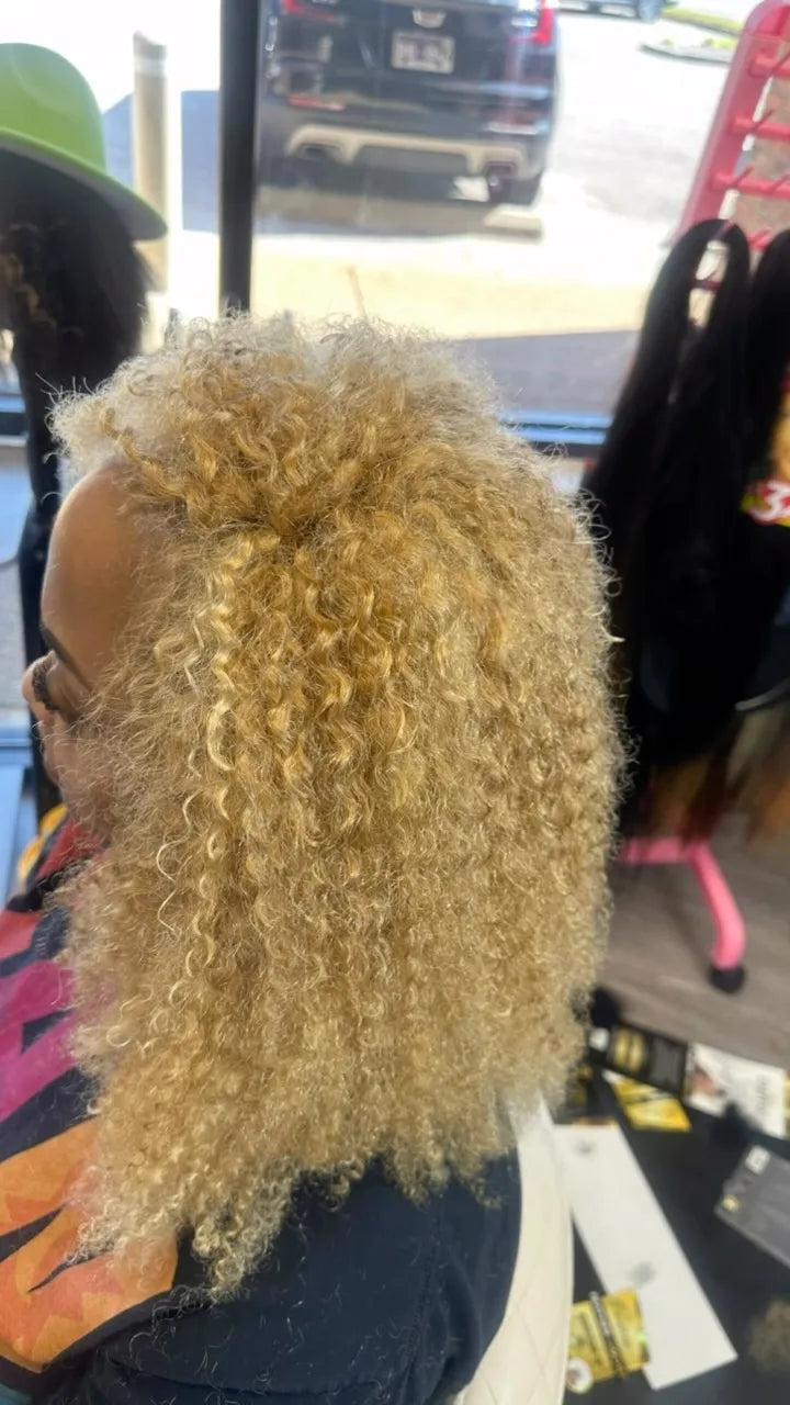 Voluminous blonde curly hairstyle with tightly defined curls and a fluffy natural-looking finish, Stylist located in Bartlett, TN