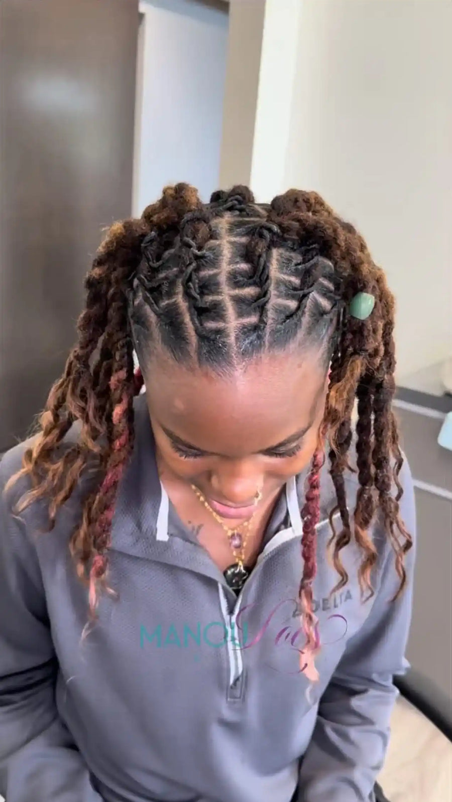 Two ponytail loc style with brown and red highlights, hairstylist in Atlanta, GA