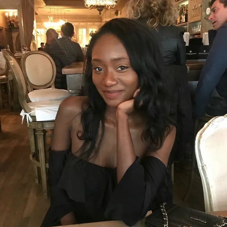 Woman sitting in a restaurant with a blurred background